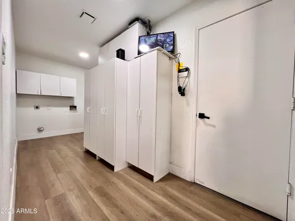 a kitchen with granite countertop a refrigerator and a sink