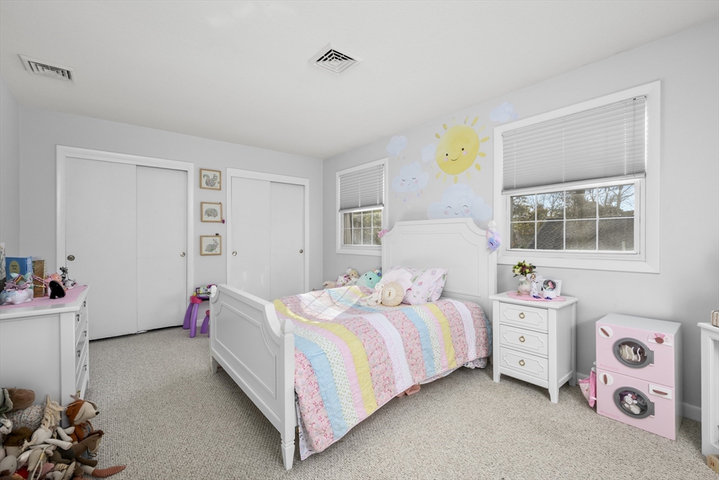 231 Route 28, Unit 20 Harwich, MA 02671 - Photo 16 of 22 a bedroom with a bed and a window