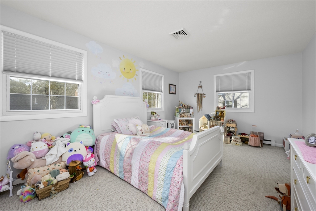 231 Route 28, Unit 20 Harwich, MA 02671 - Photo 17 of 22 a bedroom with bed and window