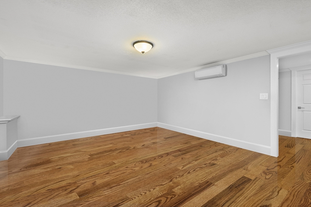 231 Route 28, Unit 20 Harwich, MA 02671 - Photo 18 of 22 a view of empty room with wooden floor