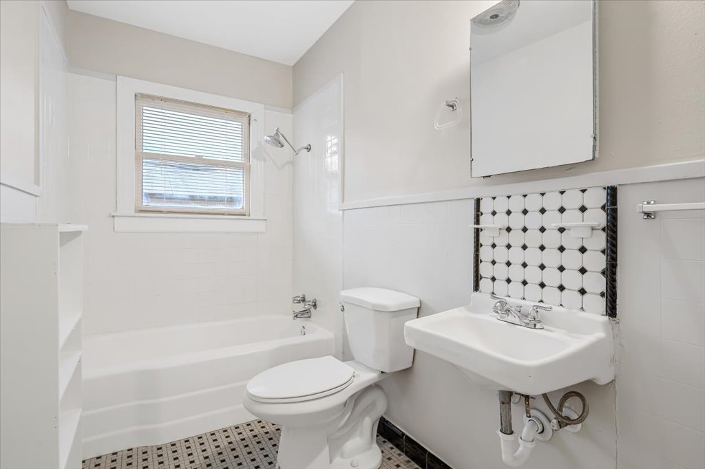 3510 Lafayette Avenue Austin, TX 78722 - Photo 12 of 15 a bathroom with a sink toilet a mirror and shower