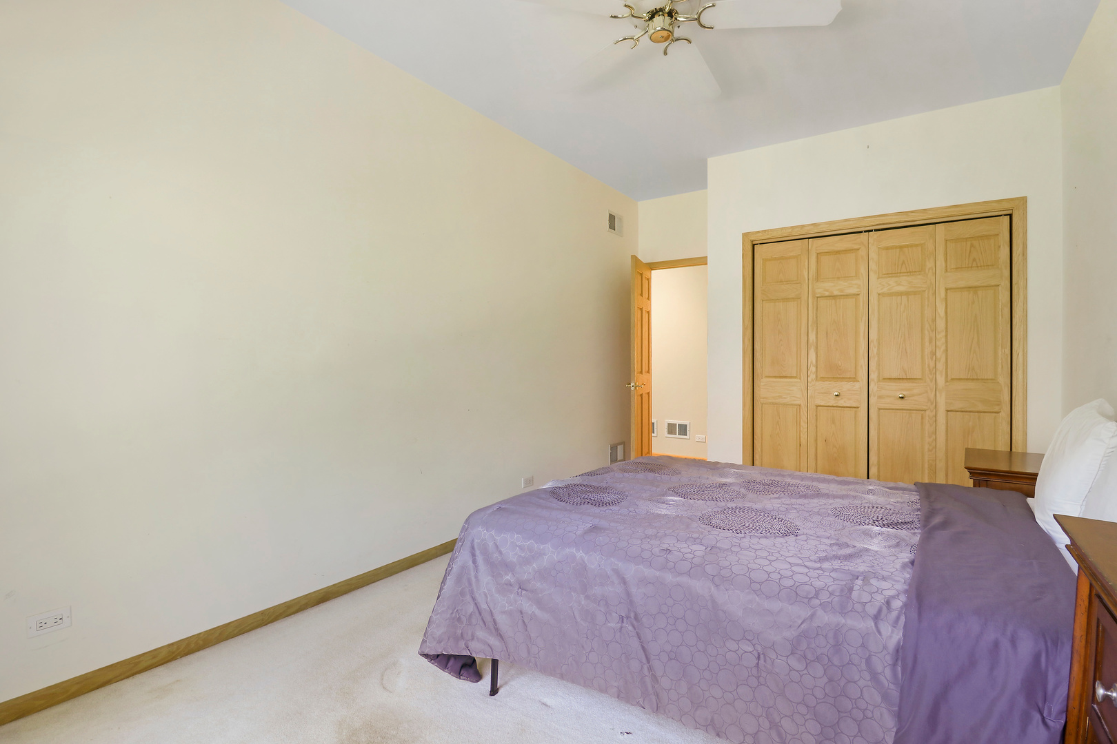 5551 Amanda Court Rolling Meadows, IL 60008 - Photo 14 of 27 a bedroom with a bed and a chandelier