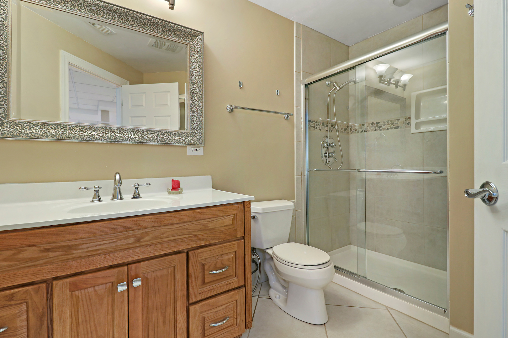 5551 Amanda Court Rolling Meadows, IL 60008 - Photo 21 of 27 a bathroom with a sink a toilet and shower
