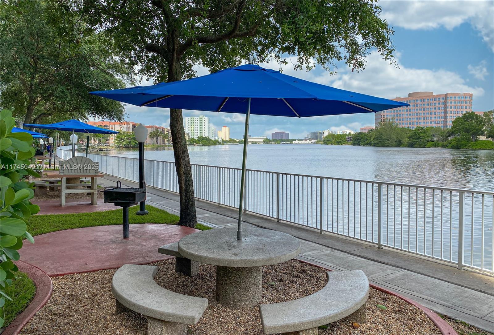 5091 Northwest 7th Street, Unit 1001 Miami, FL 33126 - Photo 16 of 17 a view of a house with porch and garden