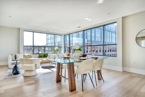 a view of a dining room with furniture window and outside view