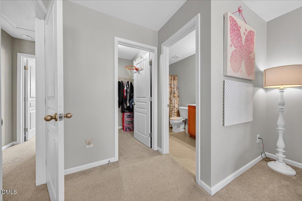 9328 Wooden Road Raleigh, NC 27617 - Photo 29 of 58 a view of an empty room and bathroom