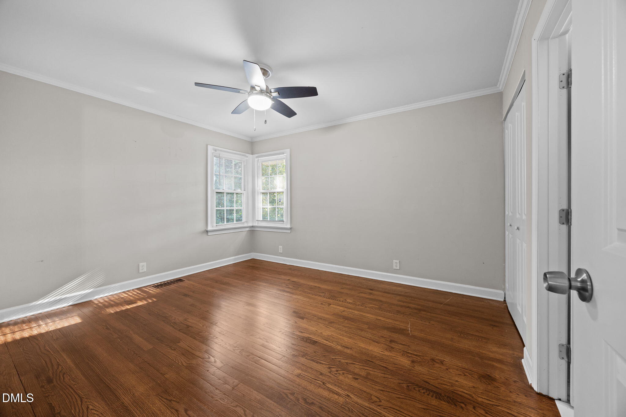 2950 Glenridge Drive Raleigh, NC 27604 - Photo 33 of 53 a view of empty room with wooden floor and fan
