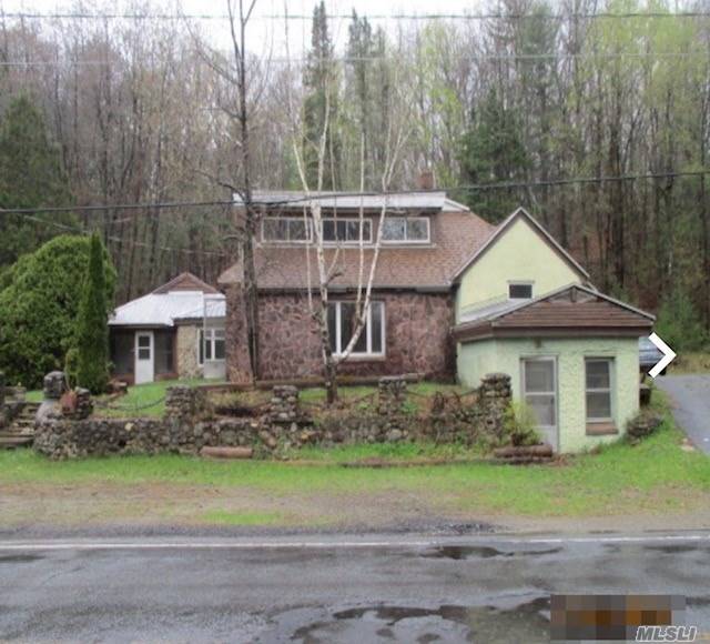 177 Glen Lake Road Lake George, NY 12845 - Photo 1 of 1 a view of a house with a yard and tree s