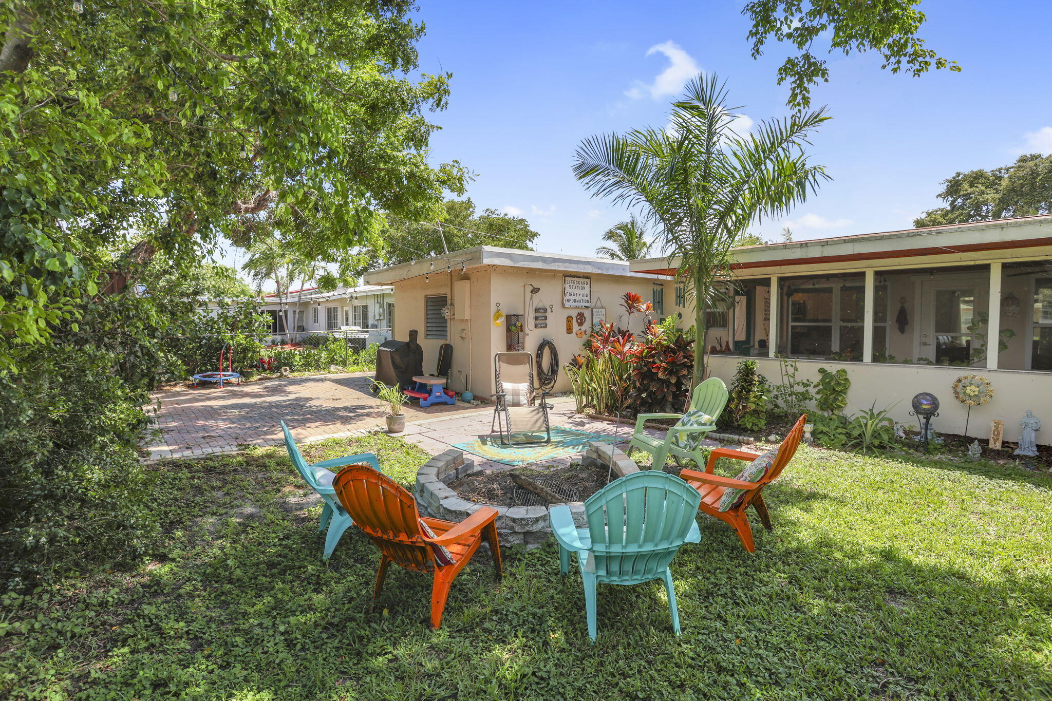 1707 High Ridge Road Lake Worth, FL 33461 - Photo 27 of 36 a view of backyard of house with seating space