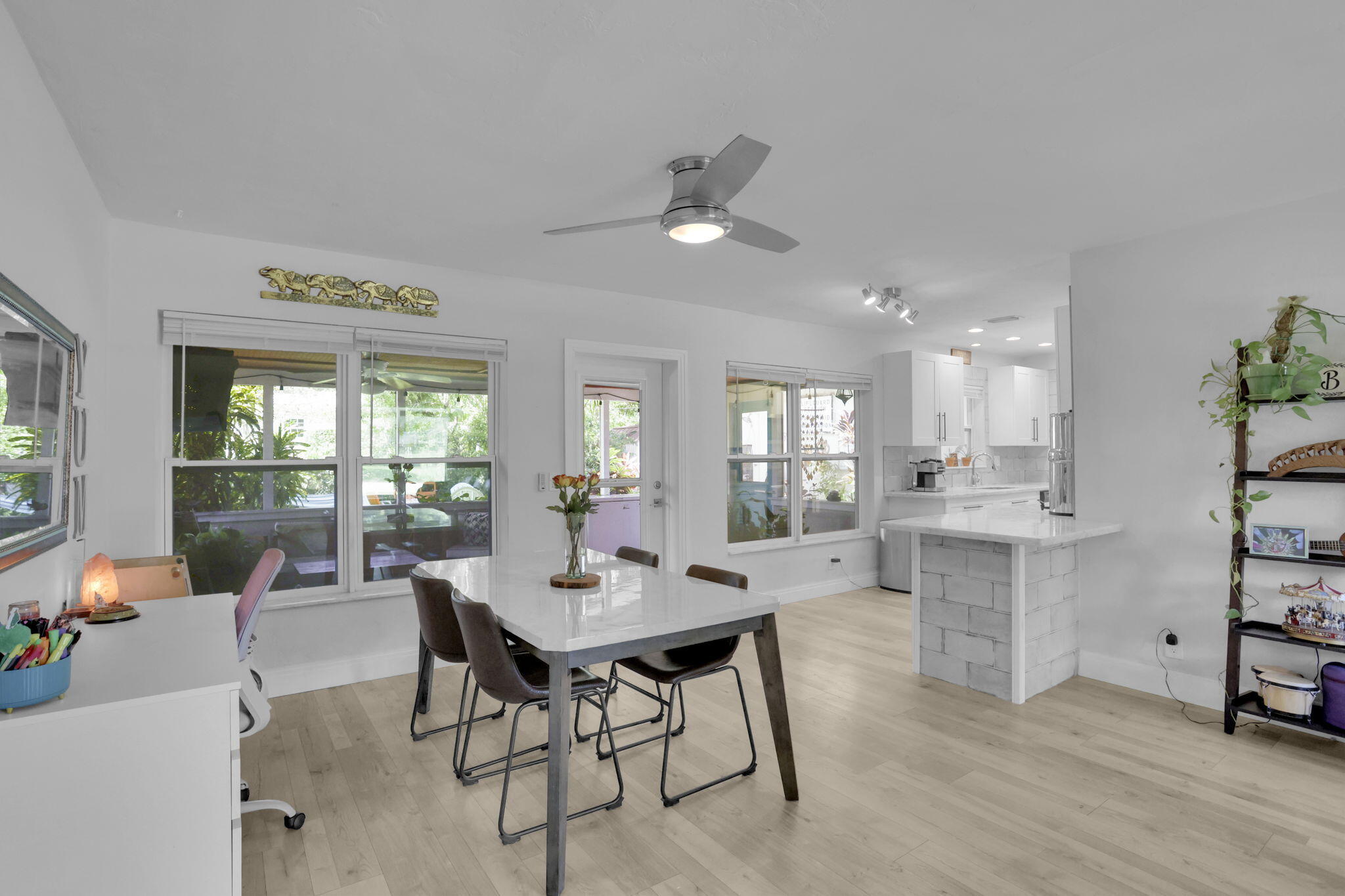 1707 High Ridge Road Lake Worth, FL 33461 - Photo 5 of 36 a view of a dining room with furniture window and outside view