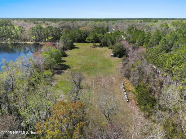 a view of lake with green space