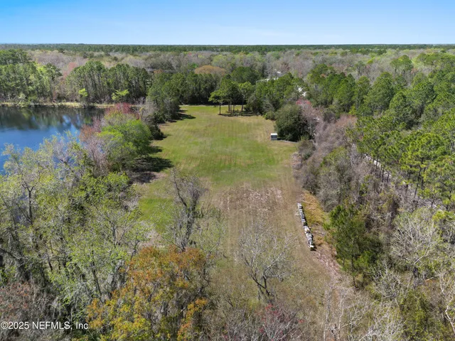 a view of lake with green space