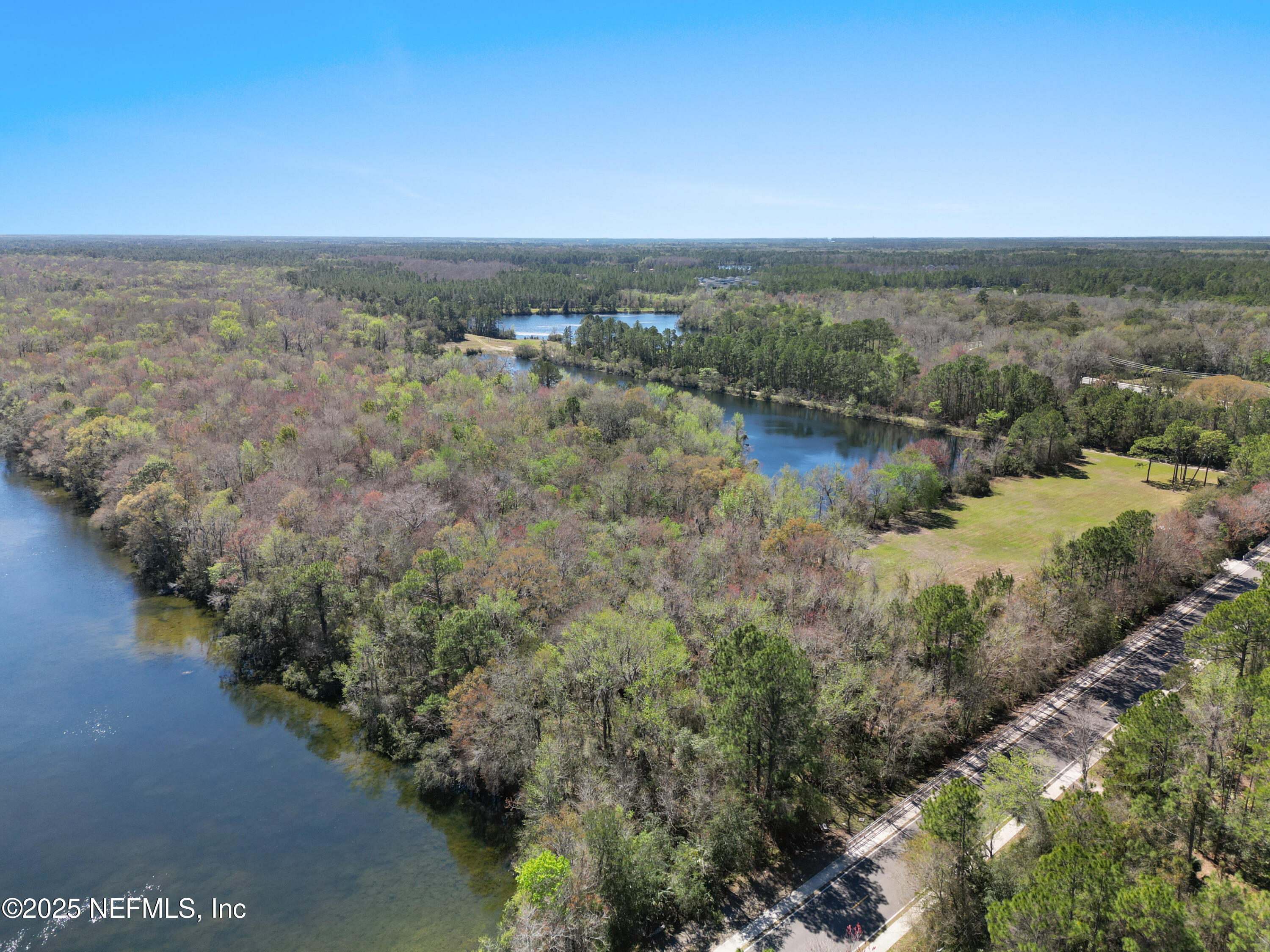 0 Deer Run Road St. Augustine, FL 32084 - Photo 4 of 12 a view of a lake with houses in back