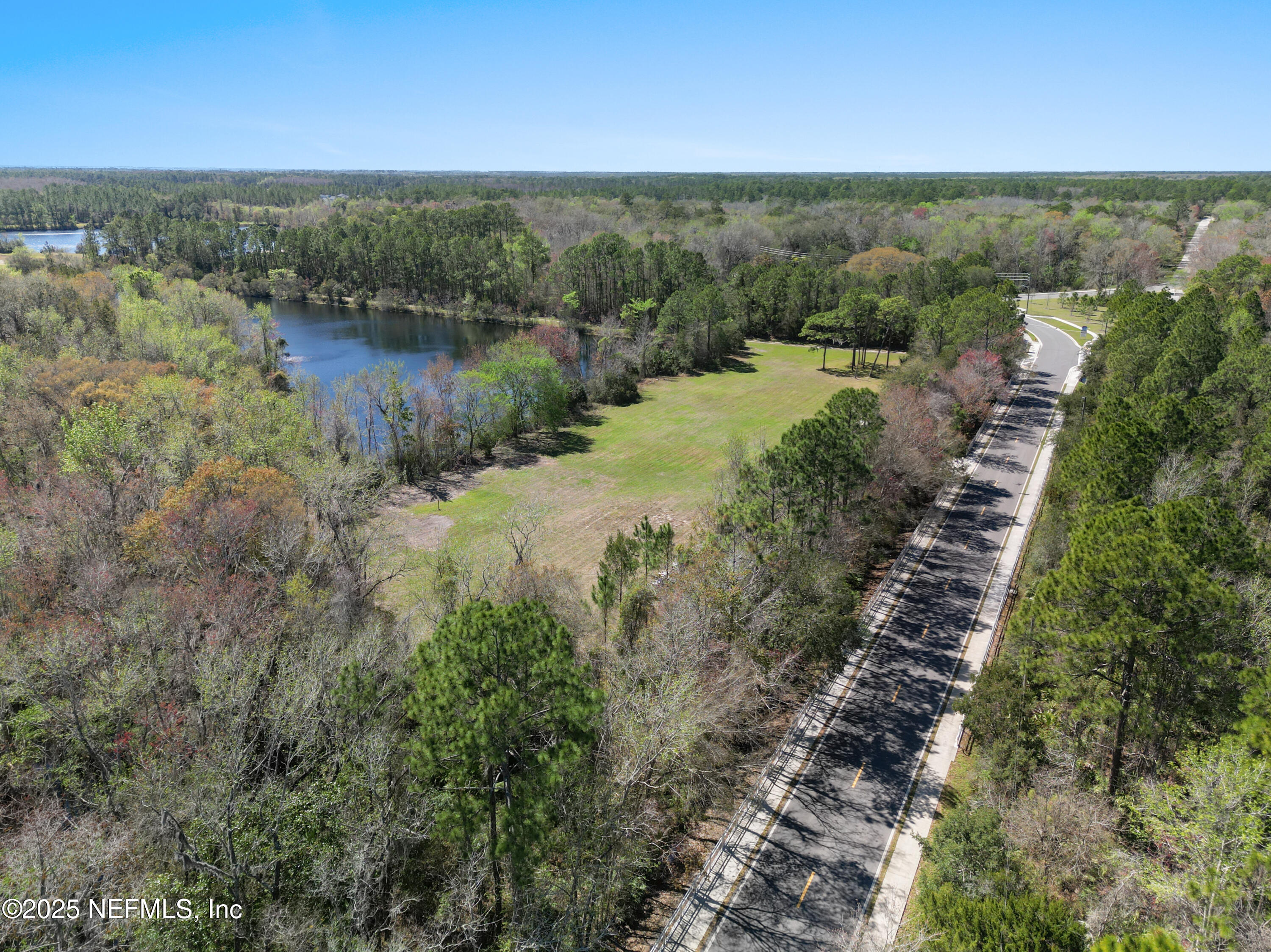 0 Deer Run Road St. Augustine, FL 32084 - Photo 5 of 12 a view of a lake with beach and outdoor space