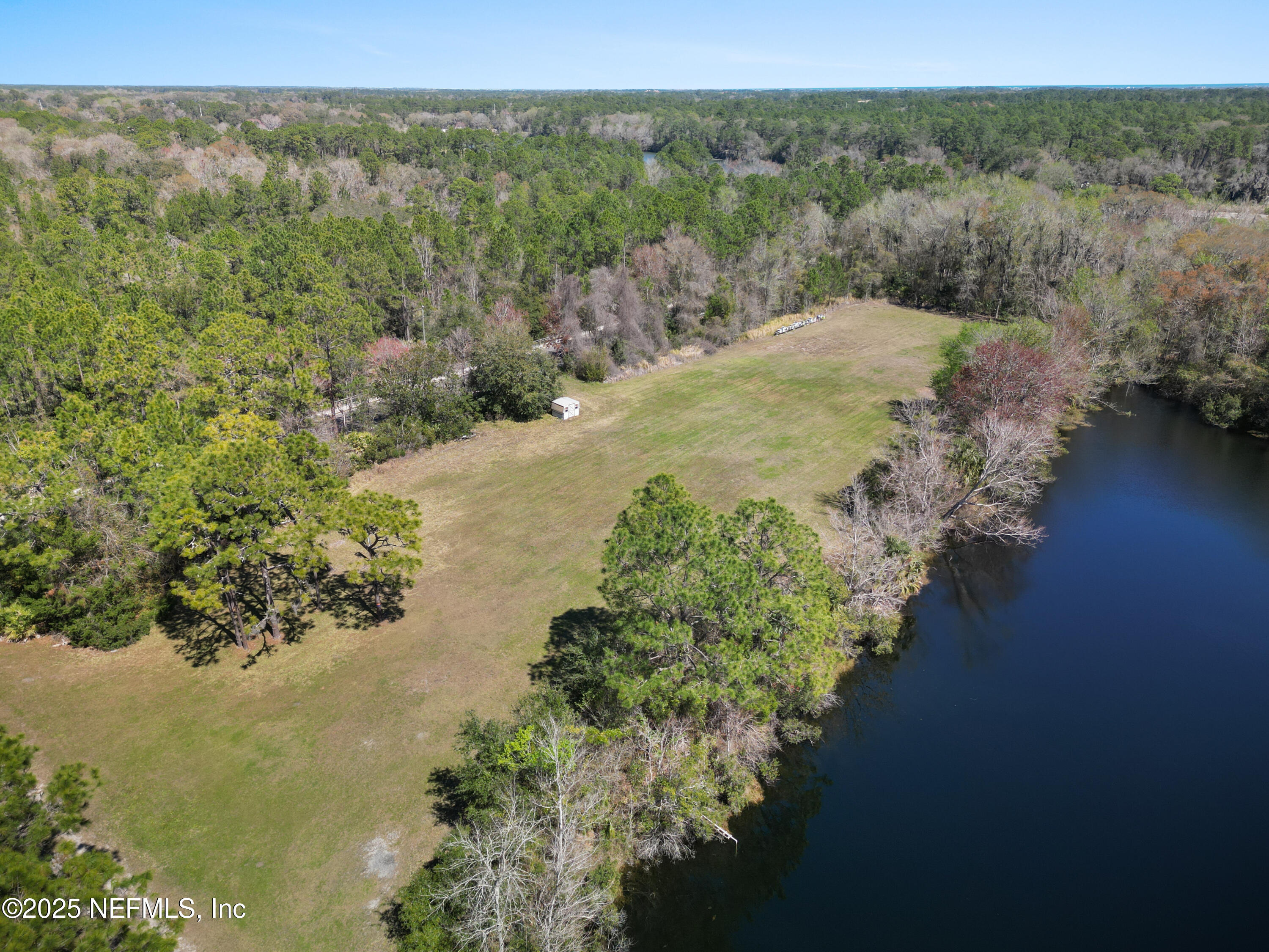 0 Deer Run Road St. Augustine, FL 32084 - Photo 6 of 12 a view of a lake with mountains in the background