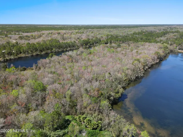 an aerial view of residential building and ocean