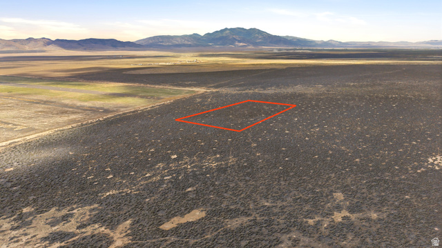 18150 West County Road, Unit 14 Cedar Valley, UT 84013 - Photo 2 of 4 Expansive undeveloped land featuring natural desert vegetation, a level topography, and a distant mountain range backdrop. (LOCATION/BOUNDARIES HIGHLIGHTED)