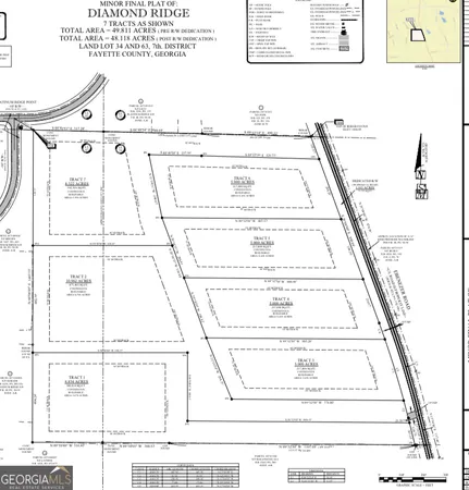 a view of a living room with a white bed