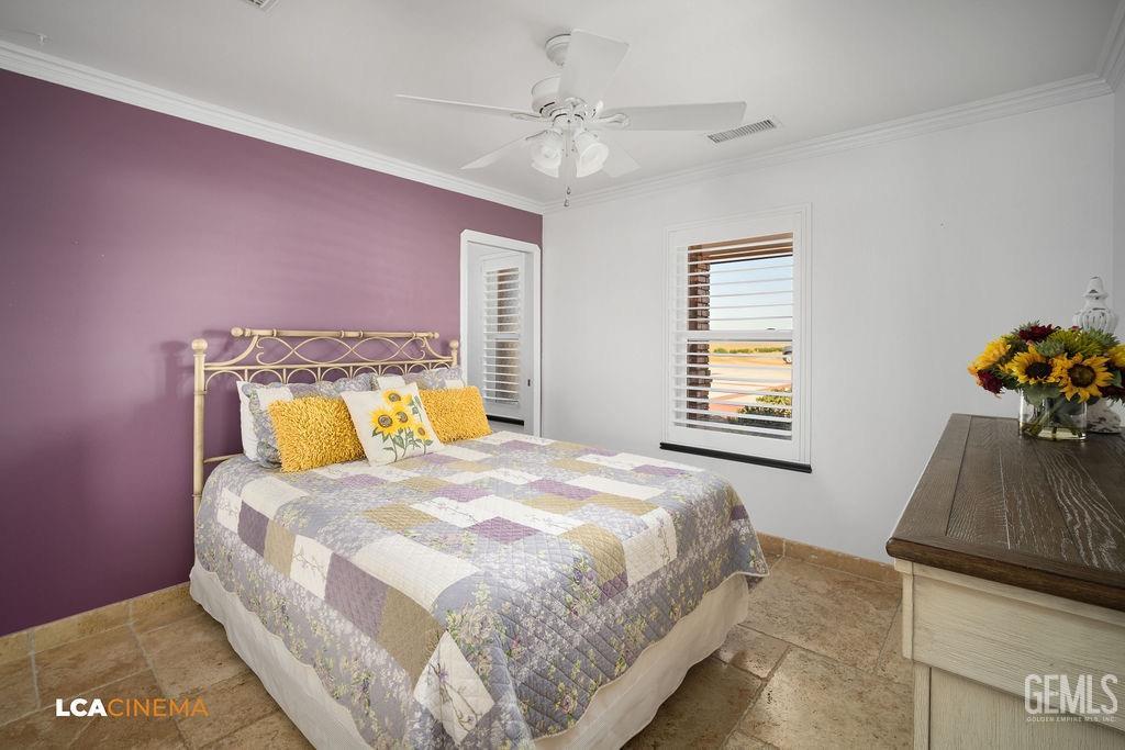 Undisclosed Address Shafter, CA 93263 - Photo 17 of 34 a bedroom with a bed and a dresser