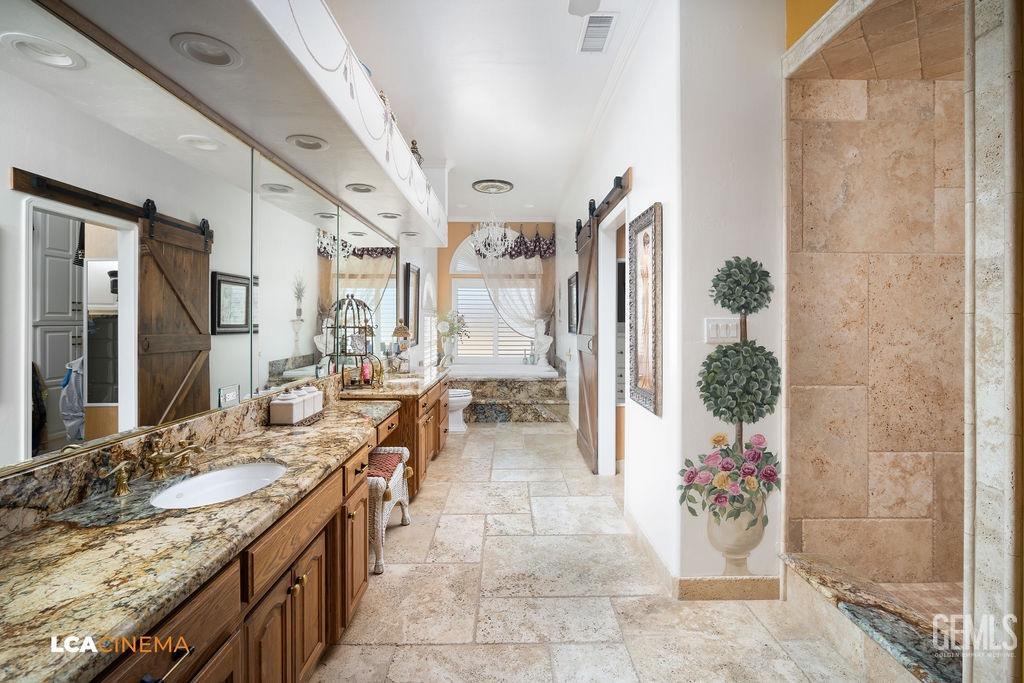 Undisclosed Address Shafter, CA 93263 - Photo 20 of 34 a bathroom with a granite countertop sink a mirror and shower