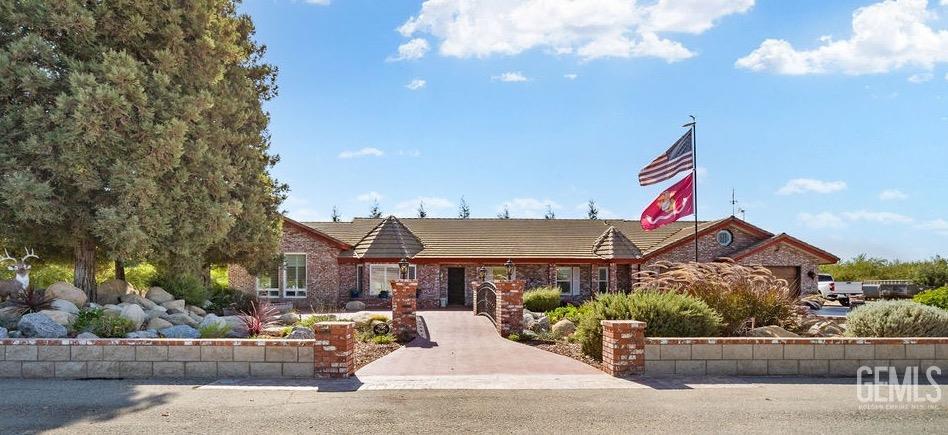 Undisclosed Address Shafter, CA 93263 - Photo 3 of 34 a front view of a building with sitting area