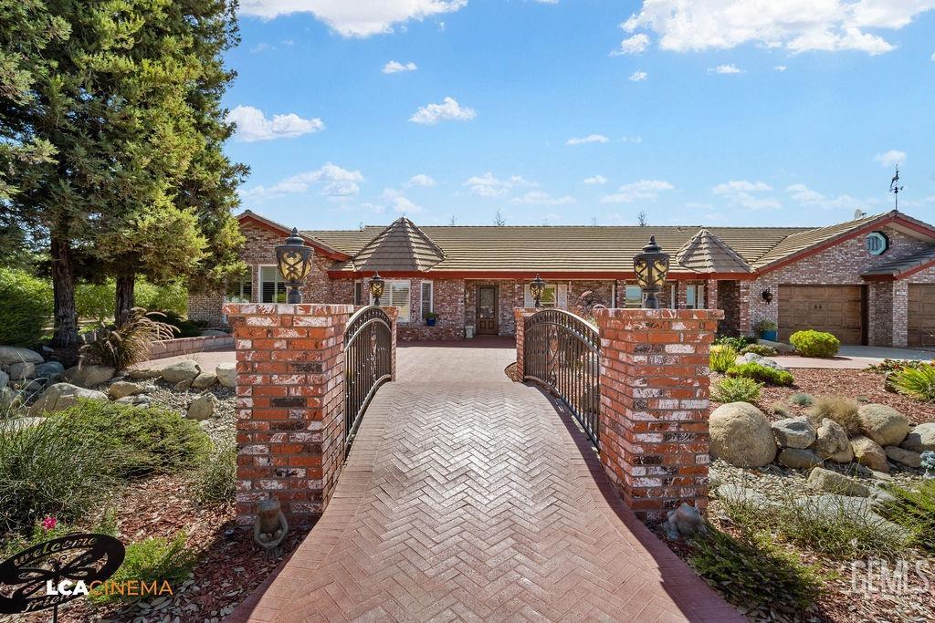 Undisclosed Address Shafter, CA 93263 - Photo 5 of 34 a view of a patio with a table and chairs under an umbrella