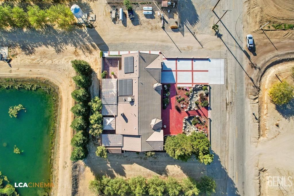 Undisclosed Address Shafter, CA 93263 - Photo 6 of 34 a view of a house with a flower garden