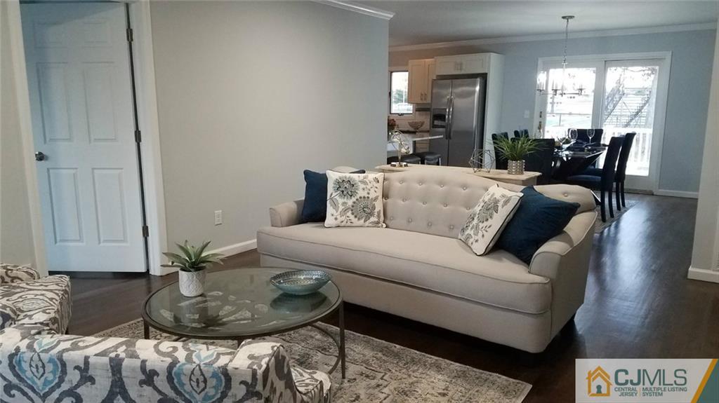 23 Ferris Road Edison, NJ 08817 - Photo 2 of 21 a living room with furniture and a potted plant