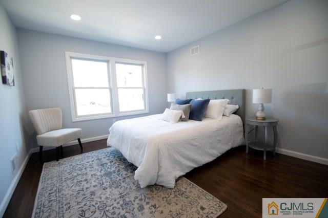 23 Ferris Road Edison, NJ 08817 - Photo 11 of 21 a bedroom with a bed and wooden floor