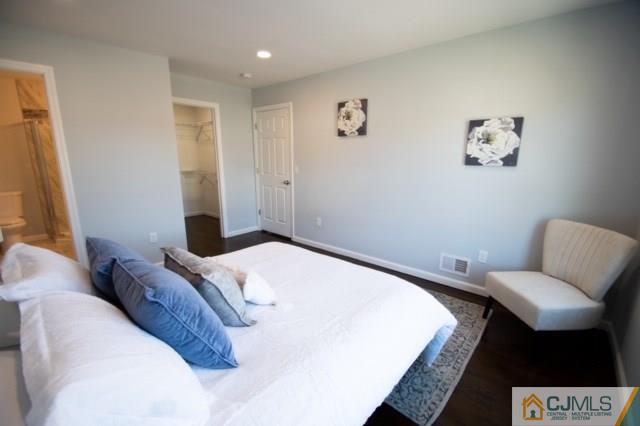 23 Ferris Road Edison, NJ 08817 - Photo 12 of 21 a bedroom with a bed and a chair