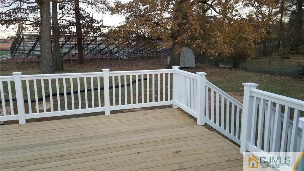 23 Ferris Road Edison, NJ 08817 - Photo 20 of 21 a view of deck with wooden floor and fence