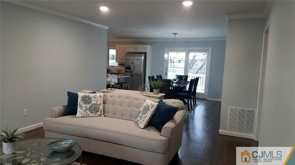 23 Ferris Road Edison, NJ 08817 - Photo 3 of 21 a living room with furniture and a large window