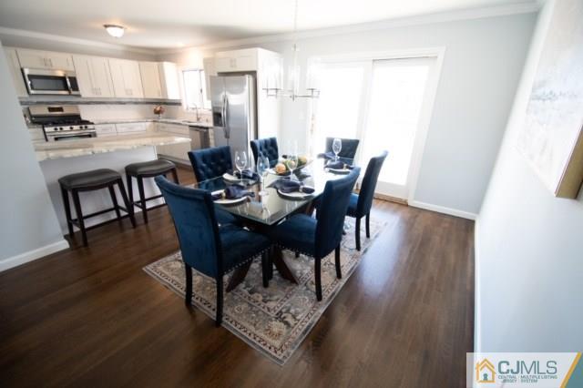 23 Ferris Road Edison, NJ 08817 - Photo 5 of 21 a view of a dining room with furniture and wooden floor