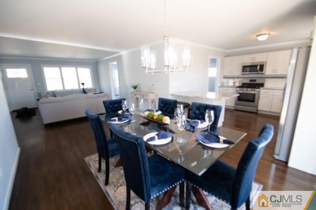 23 Ferris Road Edison, NJ 08817 - Photo 6 of 21 a view of a dining room with furniture and wooden floor