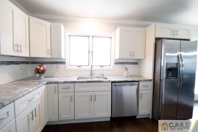 23 Ferris Road Edison, NJ 08817 - Photo 9 of 21 a kitchen with a sink stove and refrigerator