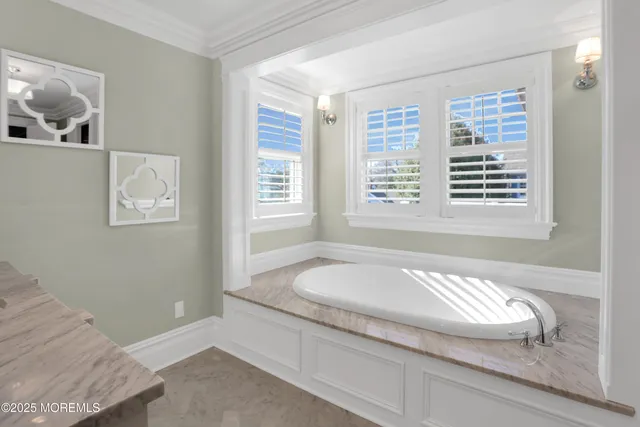 a bathroom with a granite countertop sink mirror and toilet