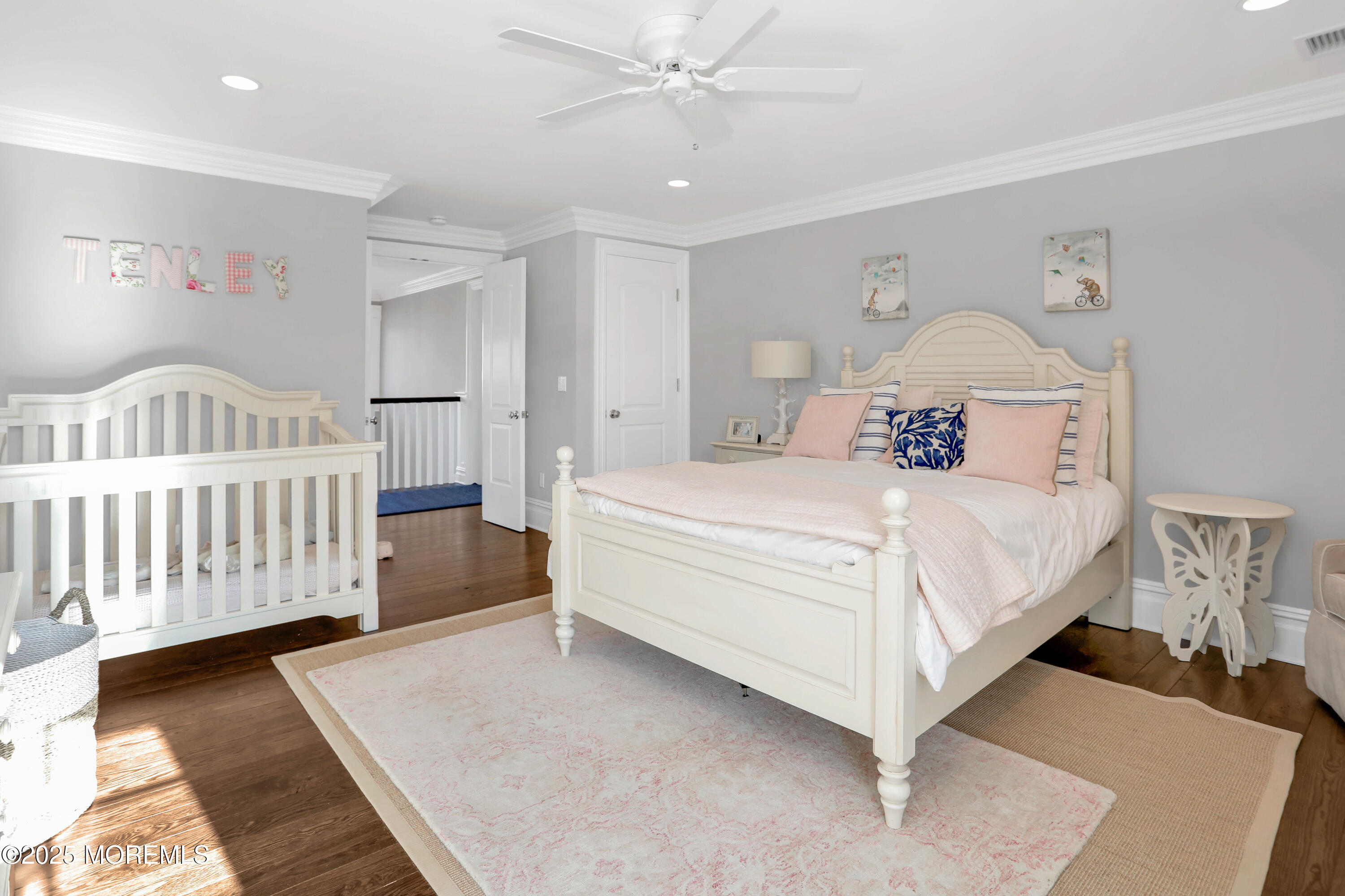 101 Tuttle Avenue Spring Lake, NJ 07762 - Photo 31 of 58 a bedroom with a bed and a chandelier