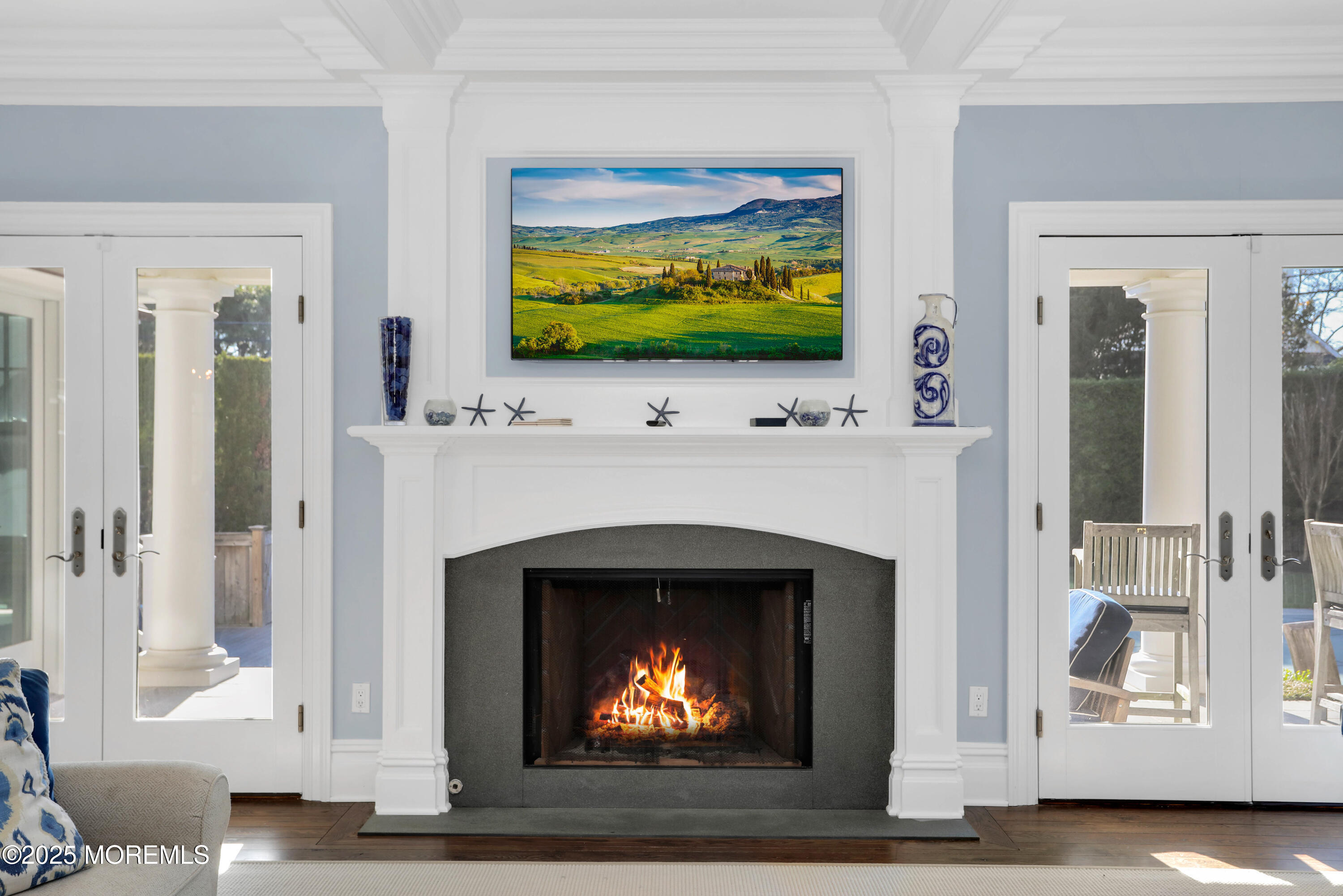 101 Tuttle Avenue Spring Lake, NJ 07762 - Photo 5 of 58 a living room with a fireplace a flat screen tv and a fireplace