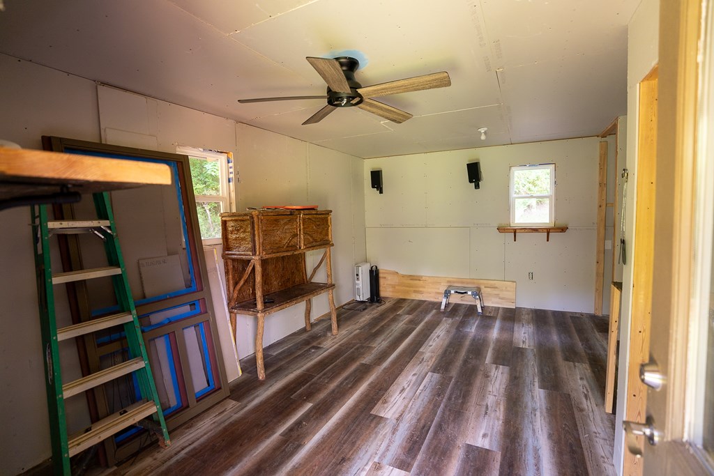 495 Midway Creek Road Murphy, NC 28906 - Photo 21 of 38 a view of a hallway with wooden floor and closet