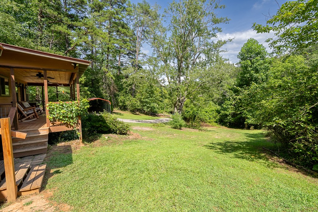 495 Midway Creek Road Murphy, NC 28906 - Photo 27 of 38 a view of swimming pool with lawn chairs and plants