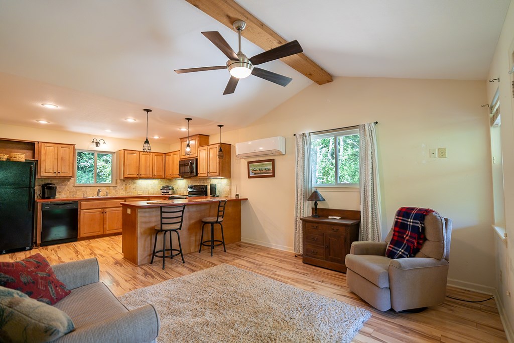 495 Midway Creek Road Murphy, NC 28906 - Photo 6 of 38 a living room with furniture kitchen area and a window