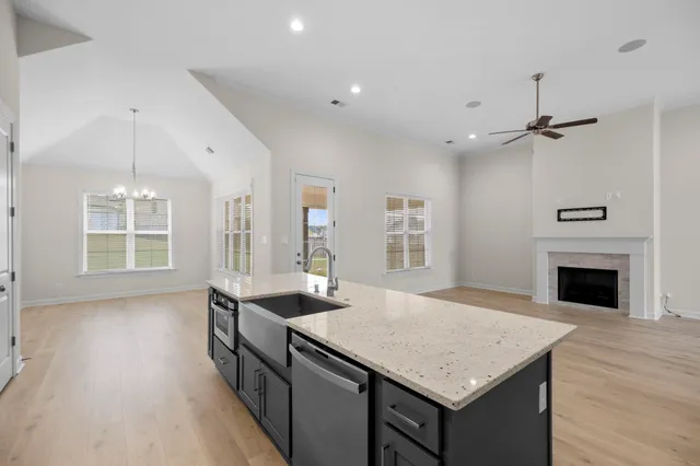 a kitchen with stainless steel appliances a sink stove and refrigerator