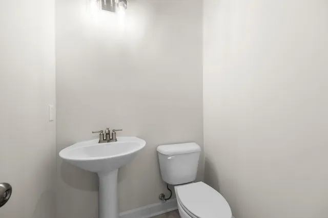 a view of an empty room with a ceiling fan