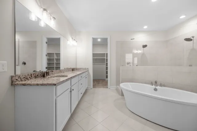 a white bath tub sitting in a bathroom