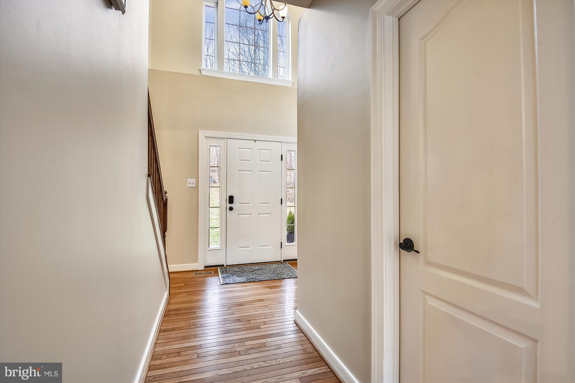484 Stratford Road Fallston, MD 21047 - Photo 7 of 44 a view of a hallway with wooden floor and staircase