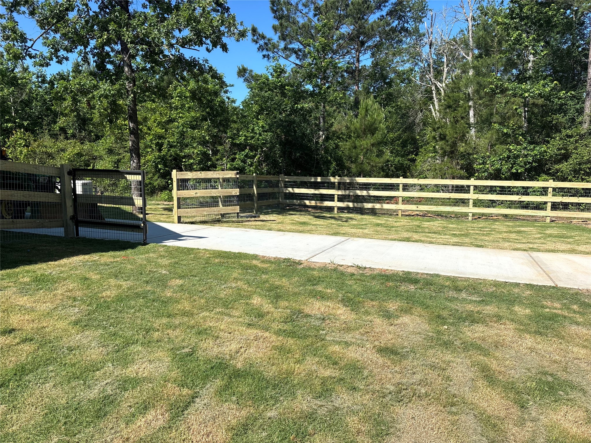 347 Iron Horse Road Willis, TX 77378 - Photo 26 of 49 Fence gate to workshop