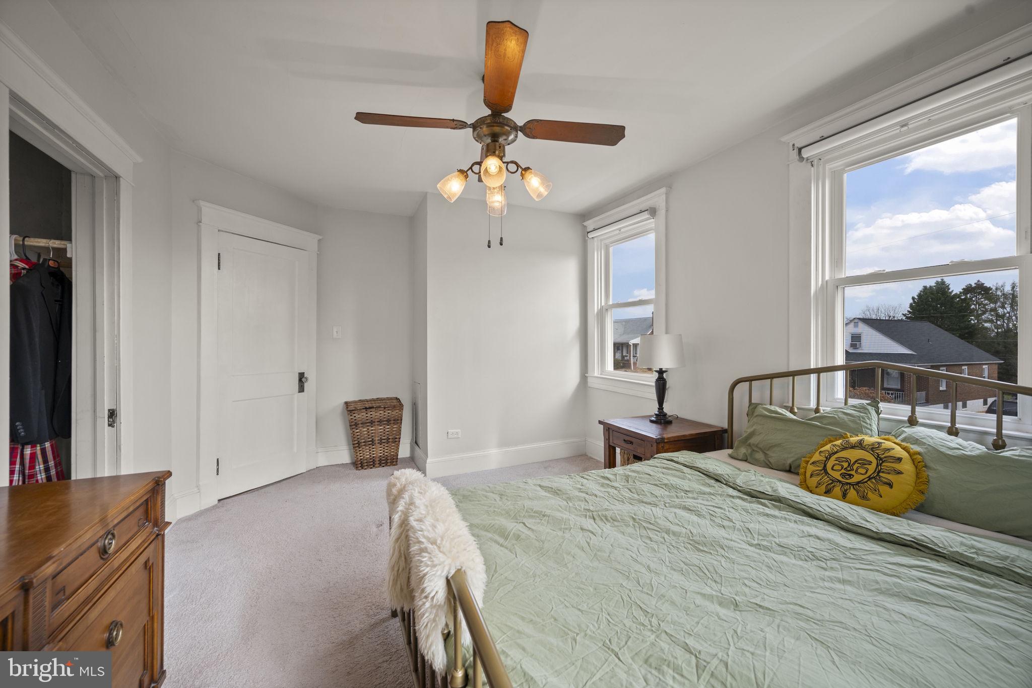 4 Elinor Avenue Baltimore, MD 21236 - Photo 15 of 47 a bedroom with a bed chandelier and a window