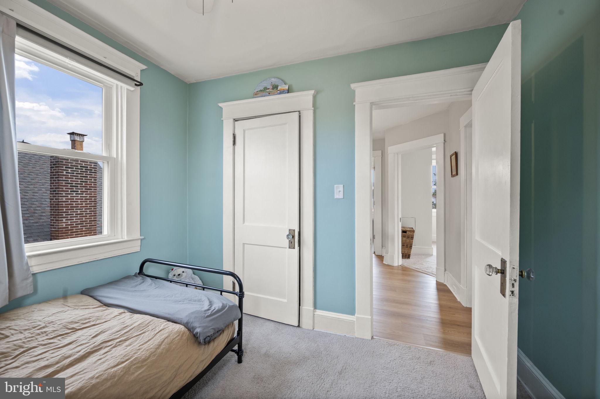 4 Elinor Avenue Baltimore, MD 21236 - Photo 22 of 47 a bedroom with a bed and a mirror