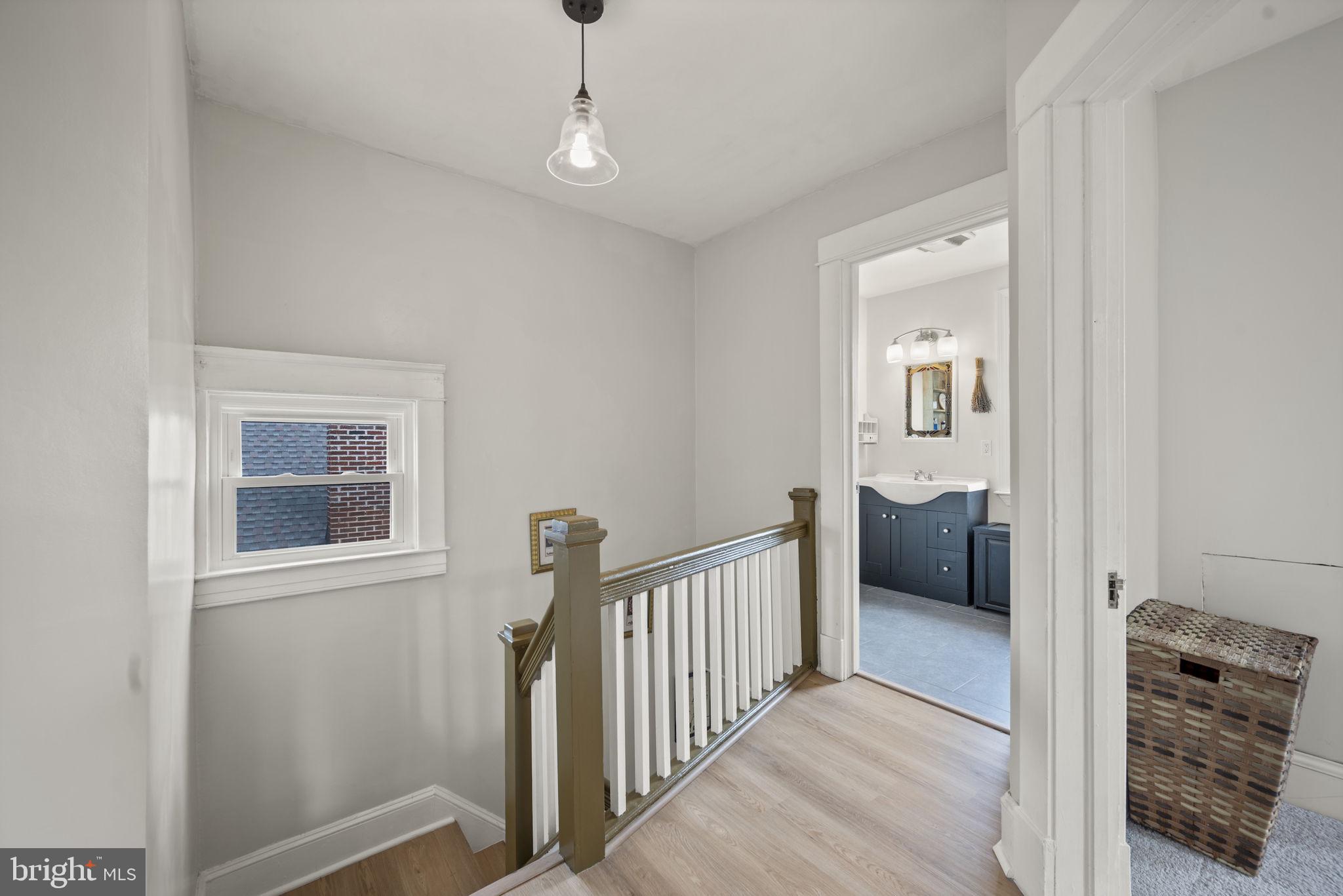 4 Elinor Avenue Baltimore, MD 21236 - Photo 23 of 47 a view of hallway with chandelier
