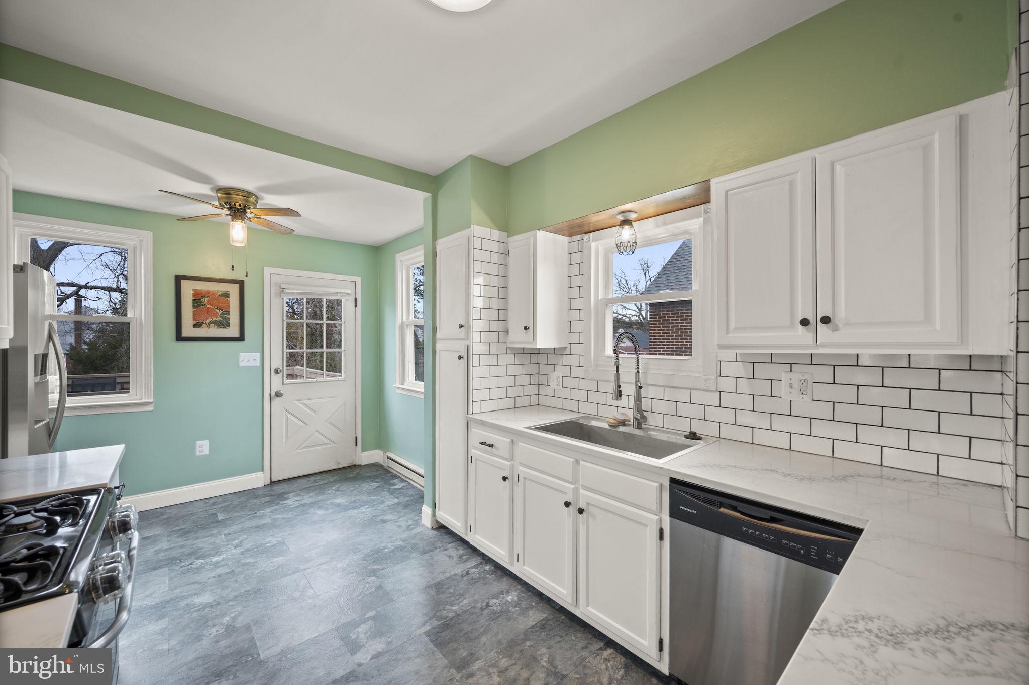 4 Elinor Avenue Baltimore, MD 21236 - Photo 6 of 47 a kitchen with a sink and cabinets